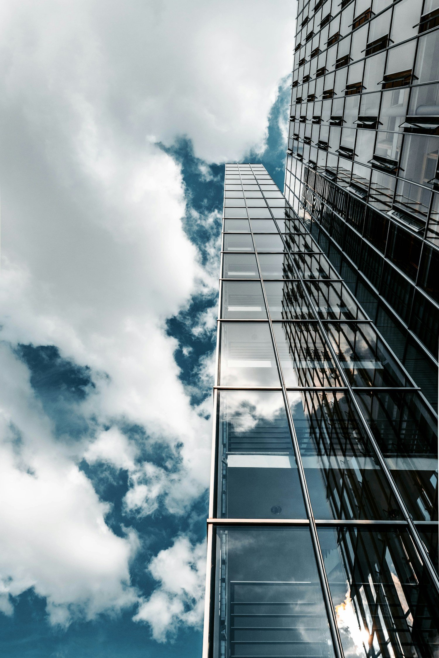 Real photograph looking upward at glass commercial office buildings